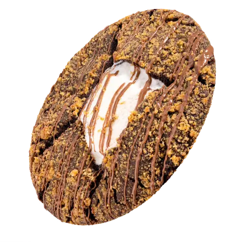 Crumbl Midnight S’mores Cookie is a rich chocolate cookie loaded with milk chocolate chips, filled with gooey marshmallow, and finished with chocolate drizzle and buttery graham cracker crumbs.